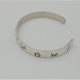 side view of sterling silver Ohio petroglyph cuff bracelet