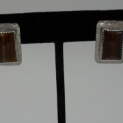 front view of tiger iron textured sterling silver post back earrings